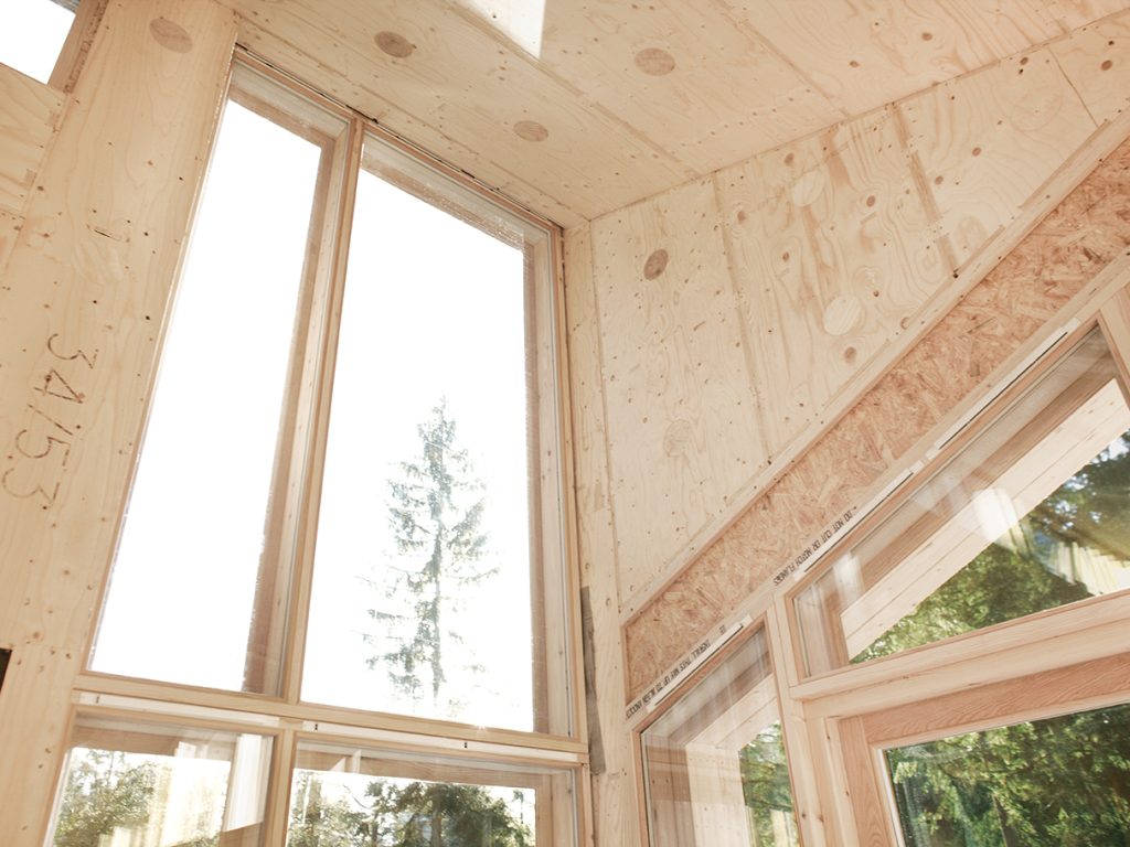 wide angel image facing ceiling corner of under construction house. House material is WISA® Plywood.
